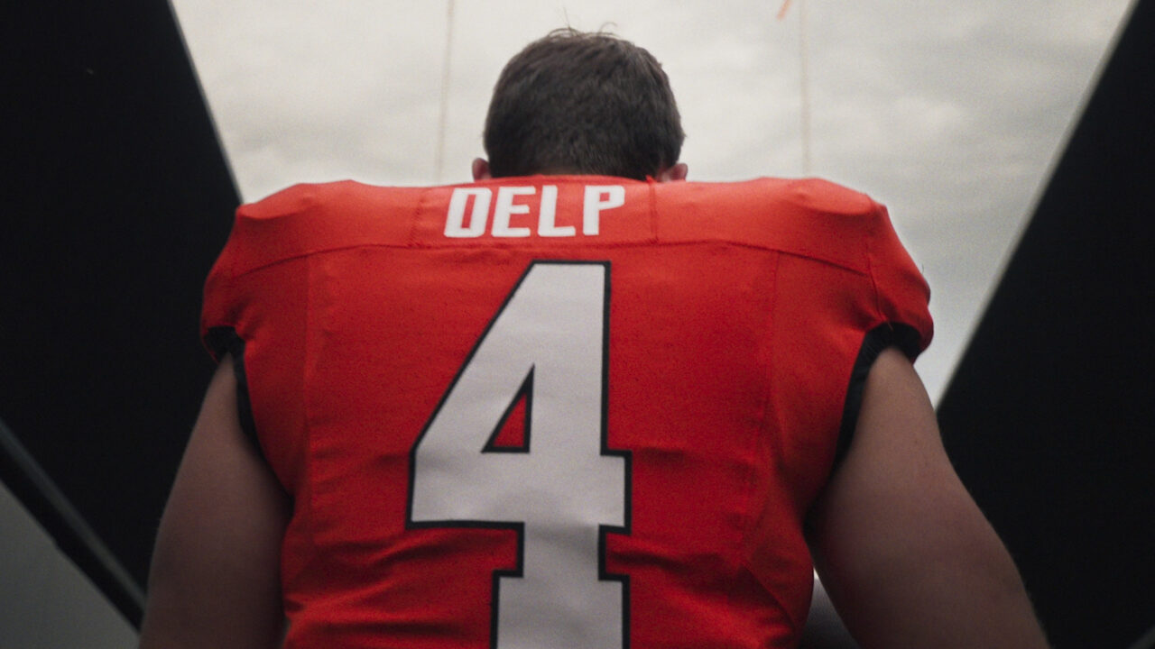 Oscar Delp walking on the field.