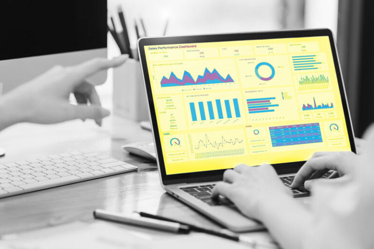 Yellow advertising collateral with bar graphs and pie charts, signifying data or analytics.